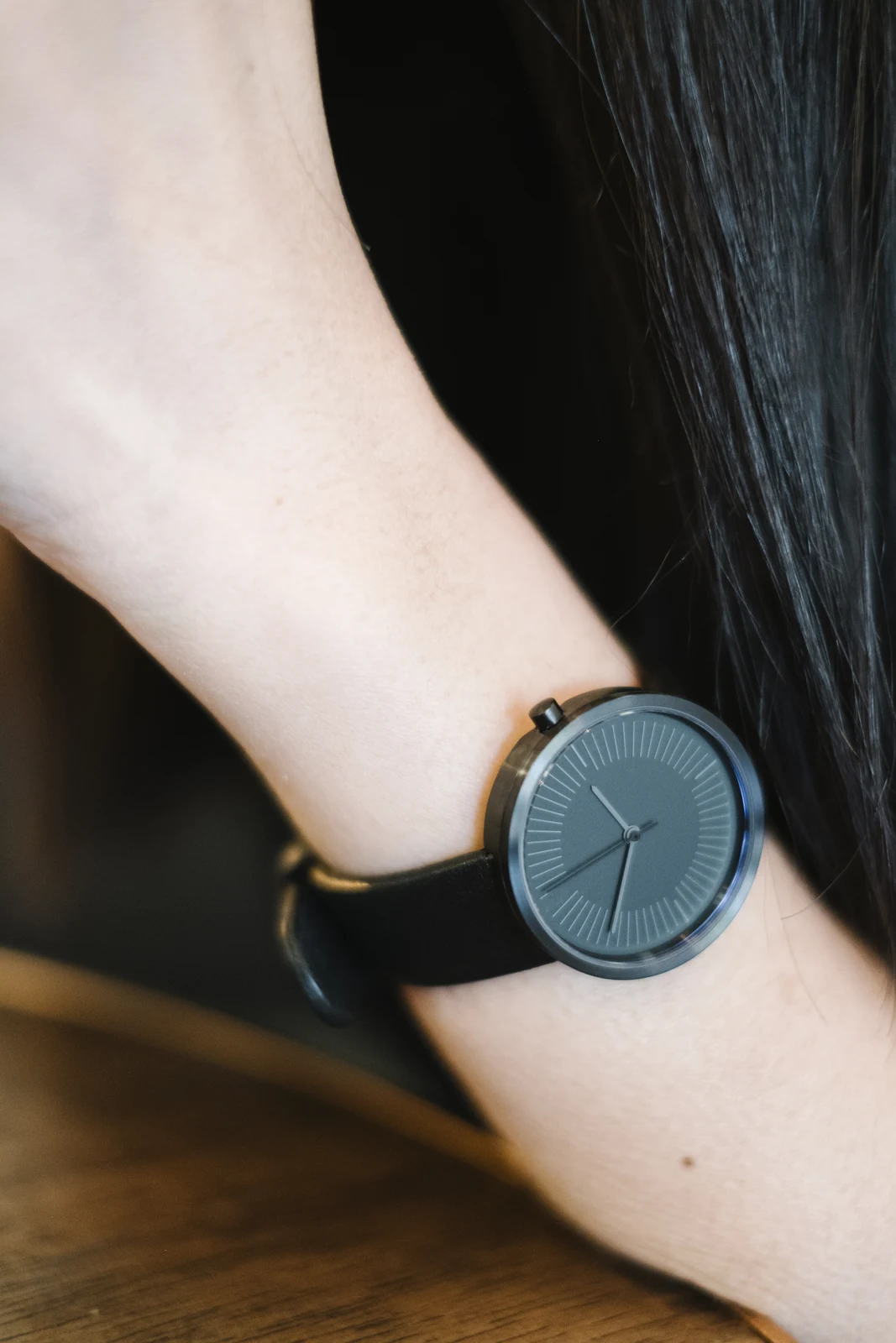 Minimalist watch with a clean dial worn on the wrist